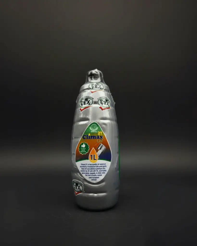 A 1-litre bottle of Climax 2T low-smoke 2-stroke engine oil for motorcycles and generators.